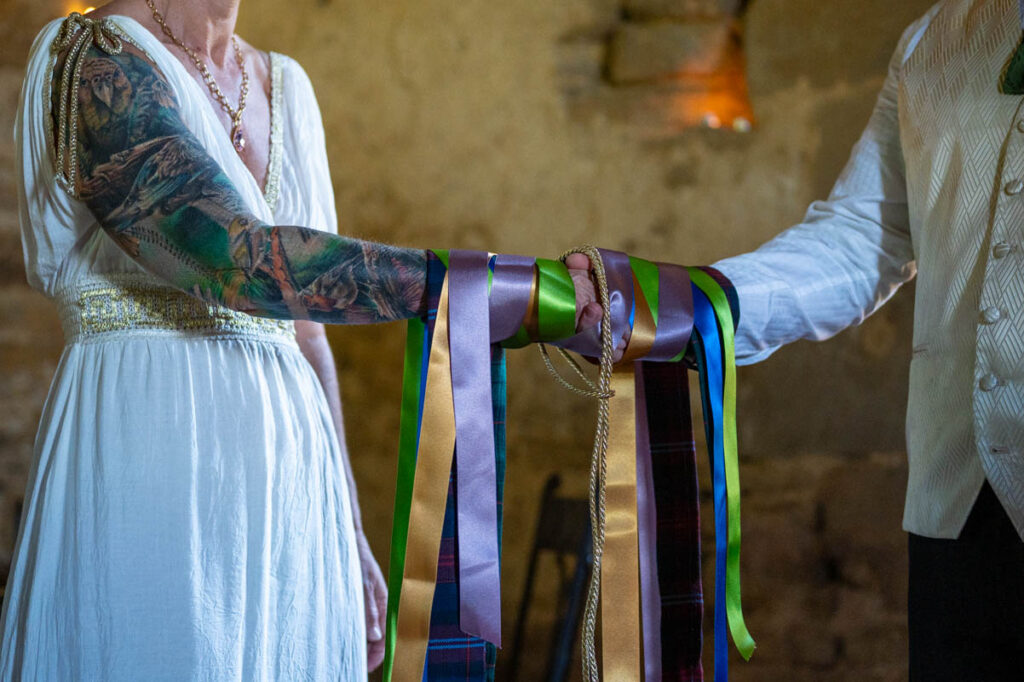 Handfasting ceremony with colourful ribbons